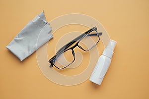 eyewear with spray and cleaning cloths on table