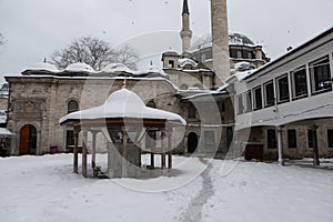 Eyup Sultan Mosque with snow in Istanbul. photo