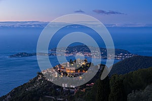 Eze Ãˆze Village, the Mediterranean Sea and Saint-Jean-Cap-Ferrat at sunrise. French Riviera, France