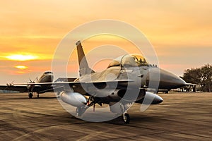 F16 falcon fighter jet on sunset background