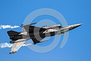 F-16 fighter jet plane flying upside down