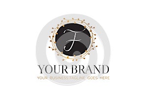 F Initial Letter Black and Gold Floral Hand Drawn Brand Logo