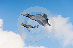 F-22 Raptor and p51 Mustang in the clouds