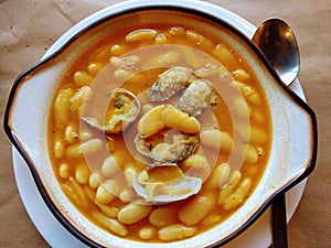 Fabes con almejas, beans with clams, typical meal in Asturias. Llanes municipality, Asturias, Spain