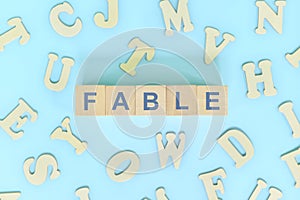 Fable narrative form in english literature concept. Wooden blocks typography word flat lay