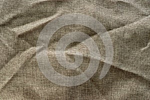 Fabric background with a structure formed by a series of light brown intertwined threads