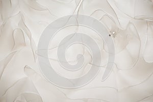 Fabric background white flounces on the wedding dress