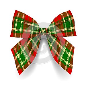Fabric bow in colors of tartan style isolated on white