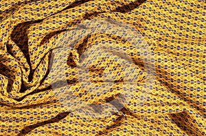 Fabric cotton is brown with a pattern of circles. Smooth and chi