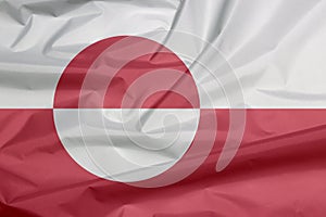 Fabric flag of Greenland. Crease of Greenland flag background.
