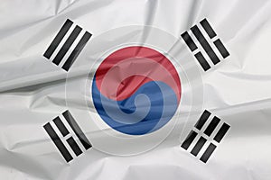 Fabric flag of South Korea. Crease of South Korean flag background. photo