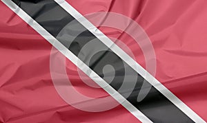 Fabric flag of Trinidad and Tobago. Crease of Trinidadian flag background. photo