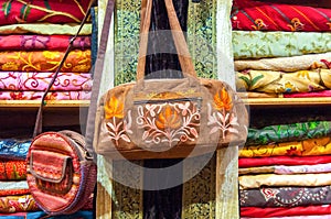 Fabric handbag on sale in a shop Muttrah Souk, in Mutrah, Muscat, Oman, Middle East photo