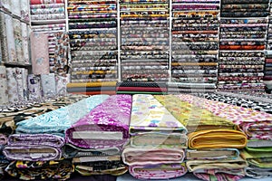 Fabric industry, textile store colorful fabric and silk. fabric background. cotton. linens. rolls of fabrics for sale