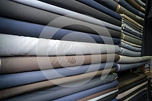 Fabric industry, textile store colorful fabric and silk. fabric background. cotton. linens. rolls of fabrics for sale