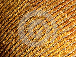 fabric knitted texture from gold colored thread