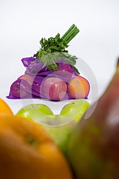 Fabric mesh for fruits and vegetables on a white background. A reusable alternative to plastic bags.