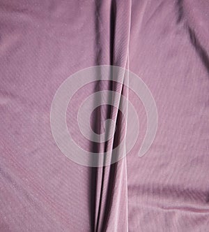 The fabric is pale pink with a matte surface. A crease in the middle.