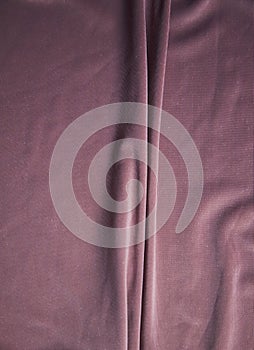 The fabric is pale pink with a matte surface. A crease in the middle.