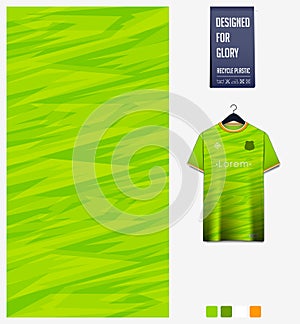 Fabric pattern design. Mosaic pattern on green background for soccer jersey, football kit, bicycle, basketball, sports uniform.