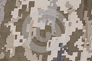 Fabric with pixellated digital camouflage pattern close-up, background, texture photo