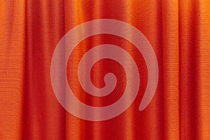 Fabric red curtains. Abstract background, curtain, drapes red fabric. Crumpled cloth, folds of fabric