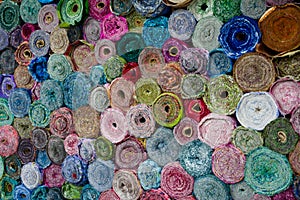 Pattern background of fabric rolls at market stall