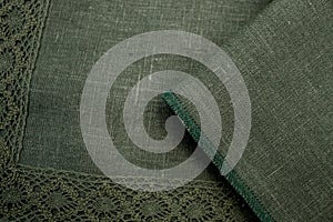 Fabric sample green natural flax with lace. Textile manufacture