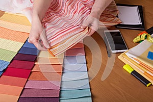Fabric samples on table, selection of colour