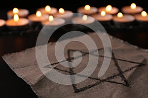 Fabric with star of David on black background. Holocaust memory day