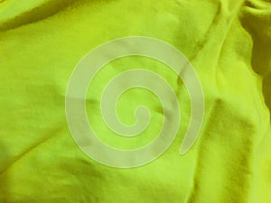 Fabric surface in bright lemon color. Background design, photography. Textile, fabric template, modern new