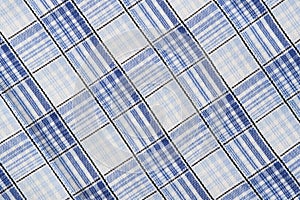 Fabric, texture checkered blue background closeup.