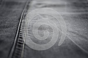 Fabric texture, cotton fabric. Close-up denim fabric selective focus , frayed jeans, grunge background