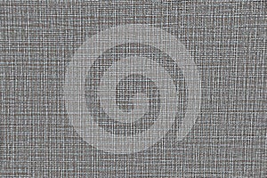 Fabric texture with intertwined gray, white and brown threads. Beautiful tissue texture for design. The background fabric with the