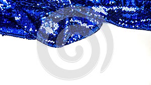 Fabric texture with spangles on white background. Glitter texture. Fabric sequins. Blue sequins pattern. Copy space