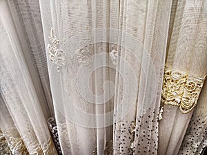 The fabric is tulle, chiffon, and transparent white curtains. Abstract background, texture, pattern. Space for text and