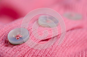 Fabric warm pink sweater buttons textile material texture