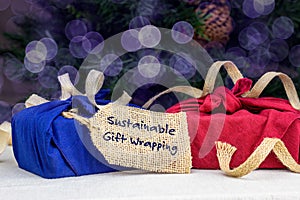 Fabric wrapping for gifts, sustainable living concept, zero waste, recycle, reuse, sustainable gift wrapping text