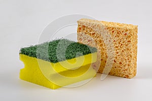 Fabricated dish sponge and natural honeycomb sponge isolated. photo