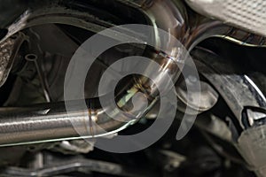 Fabrication and installation of a stainless steel car exhaust pipe with a bifurcation and a louder sound with a color weld under