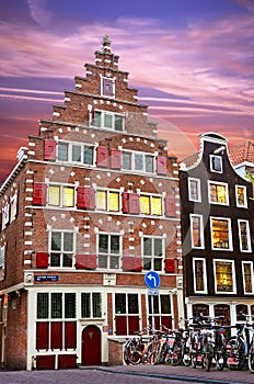 Fabulous ancient medieval houses with shutters at dusk and bikes