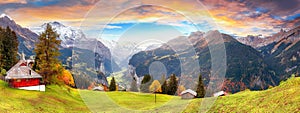 Fabulous autumn view of picturesque alpine Wengen village and Lauterbrunnen Valley