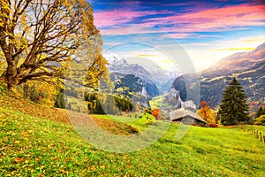Fabulous autumn view of picturesque alpine Wengen village and Lauterbrunnen Valley