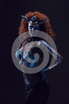 Fabulous female from fairytale with blue black body art