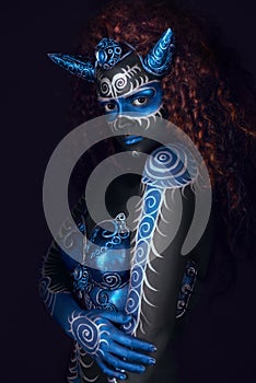 Fabulous female from fairytale with blue black body art