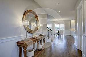 Fabulous foyer features a wood console table photo