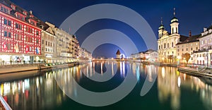 Fabulous historic city center of Lucerne with famous buildings and promenade during night