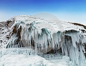 Fabulous ice icicles on the rocks of lake Baikal. Eastern Siberia,