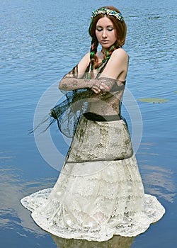 A fabulous, lake nymph in wreath.