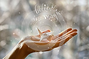 Fabulous paper crane in the palm of your hand. Believe in magic